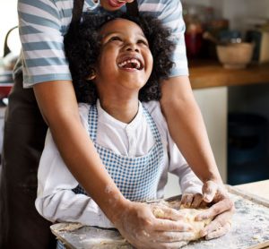 Child and mother with baking kit